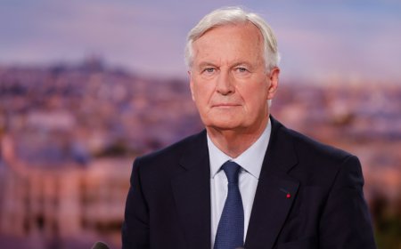 New French PM vows to toughen stance on immigration, hints at tilt to right